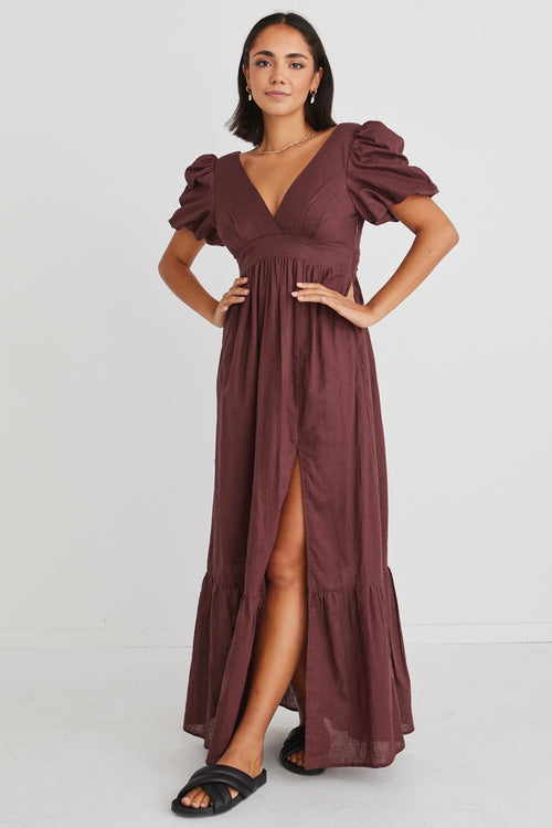 model posing in long brown maxi dress