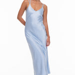 model wears a blue slip dress