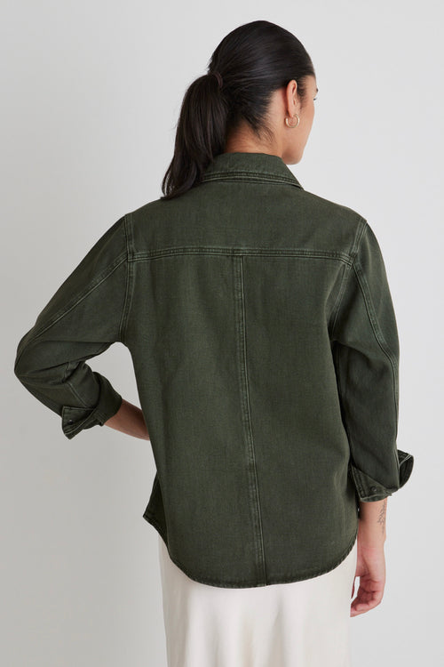 Model wears a green denim shacket