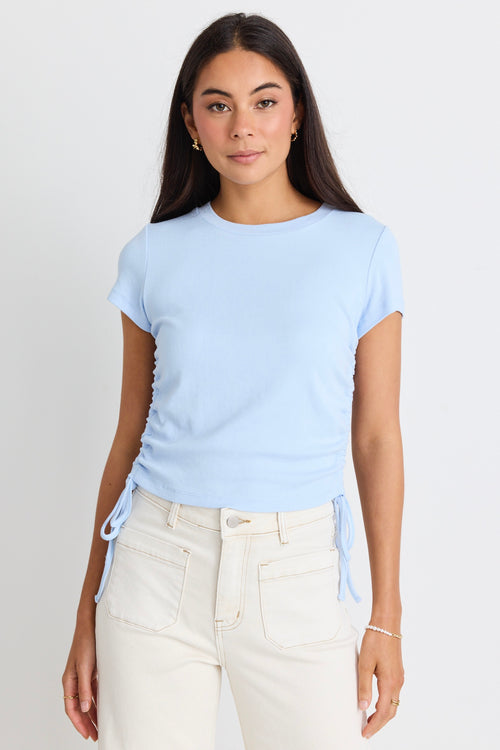 model wears a blue t-shirt