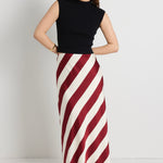 model wears a red white stripe maxi skirt