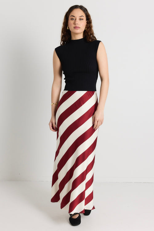 model wears a red white stripe maxi skirt