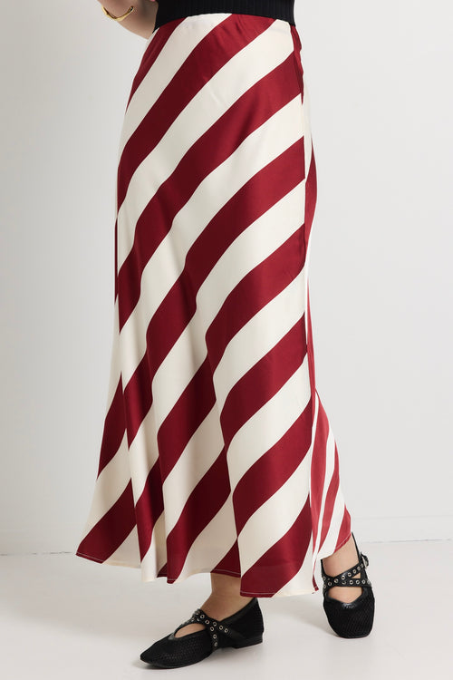 model wears a red white stripe maxi skirt