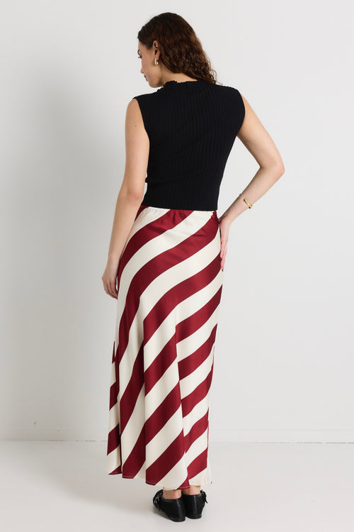 model wears a red white stripe maxi skirt