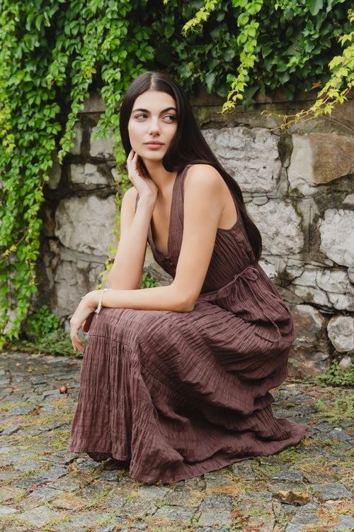 model wears a brown cotton maxi dress