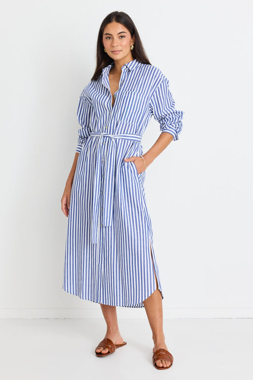 model wears a blue stripe shirt dress