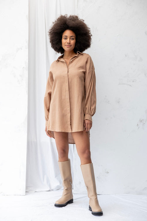 Model wears a clay shirt dress