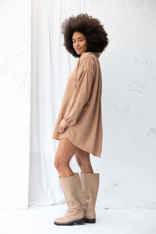 Model wears a clay shirt dress