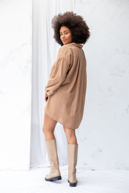 Model wears a clay shirt dress