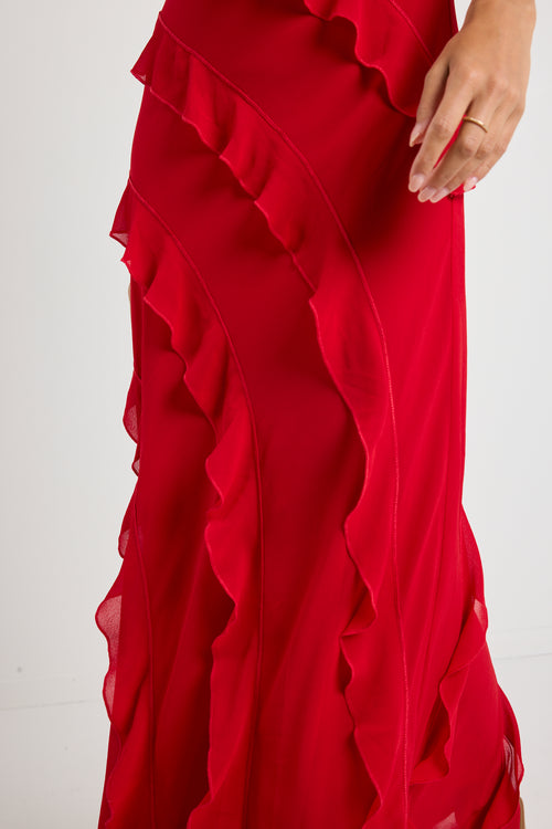 Model wears a red ruffle maxi dress 