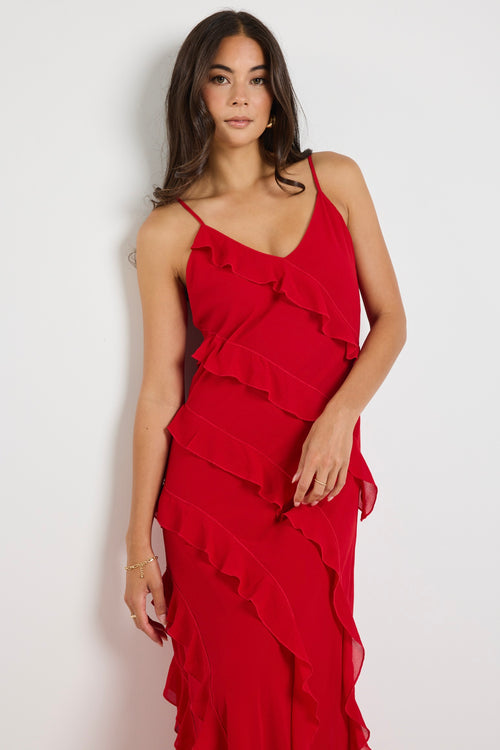 Model wears a red ruffle maxi dress 