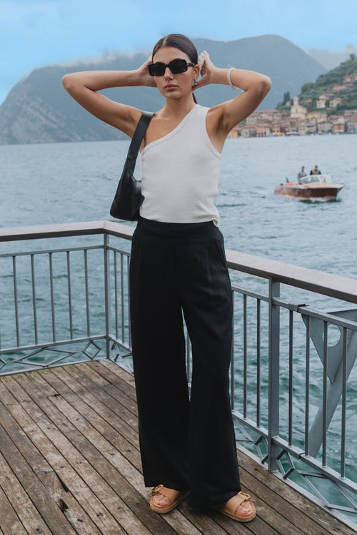 model wears black linen pants