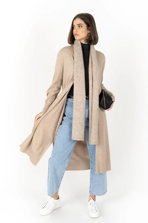 model wears a biege cardigan