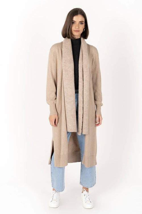 model wears a biege cardigan