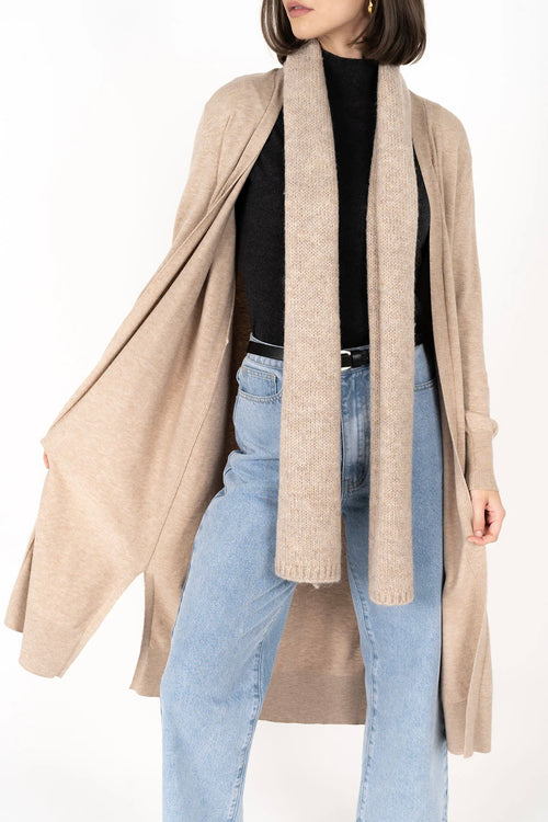 model wears a biege cardigan