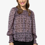 model in purple floral long sleeve top