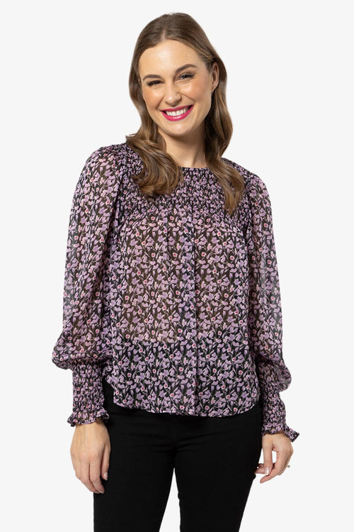 model in purple floral long sleeve top