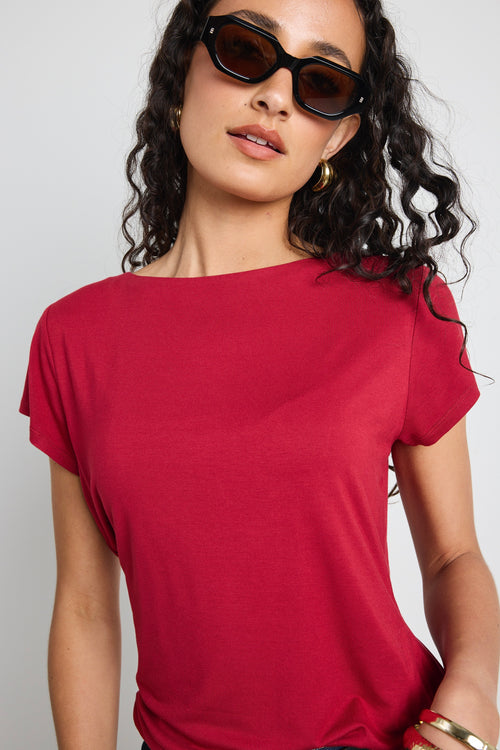 model wears a red t shirt