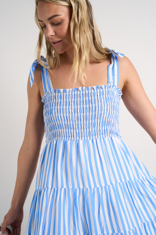 model wears a blue stripe maxi dress