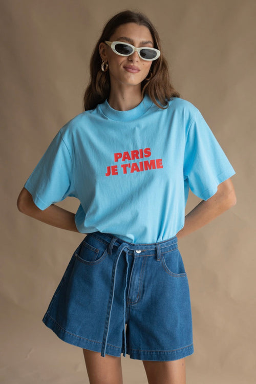 model wears a blue tee