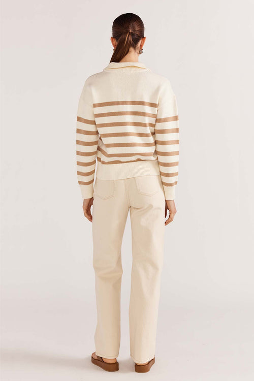 model wears a beige stripe knit