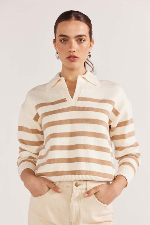 model wears a beige stripe knit