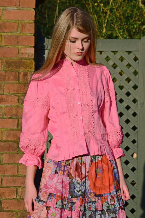 Model wears pink lace blouse