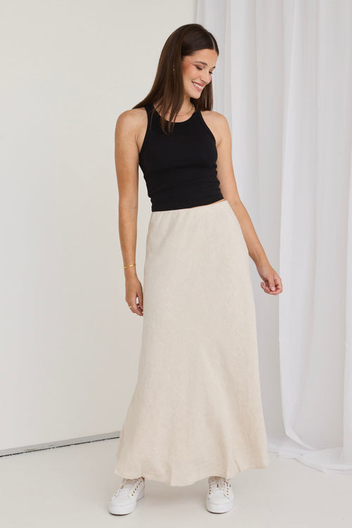 model wears a beige maxi skirt