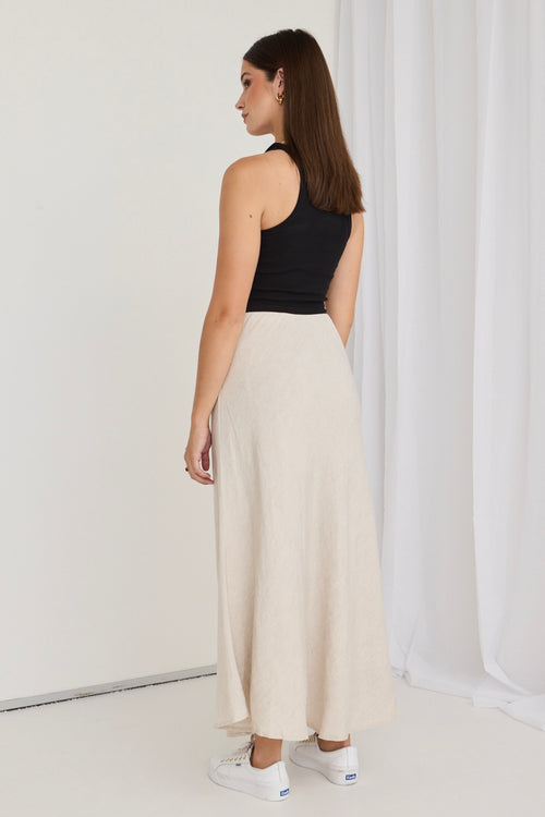 model wears a beige maxi skirt