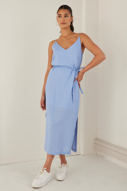 model wears a blue linen midi dress