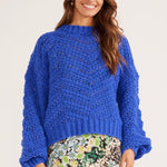 model wears a blue knit