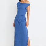 model wears blue off the shoulder maxi dress