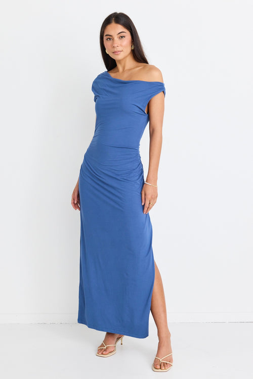 model wears blue off the shoulder maxi dress