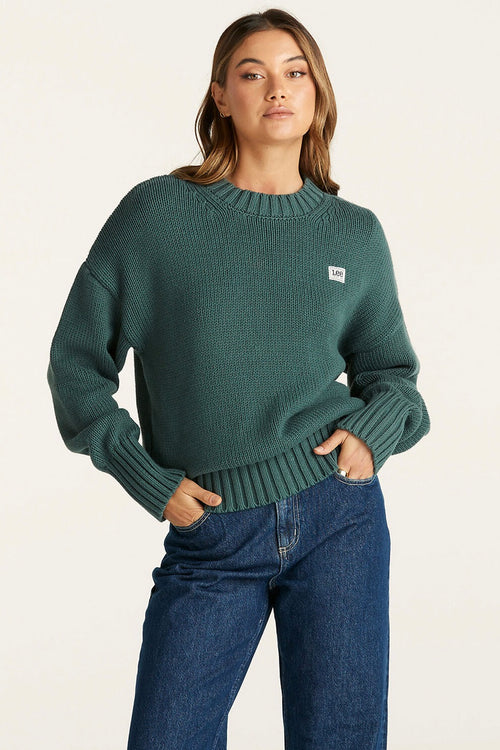 Model wears a Green Knit Sweater 