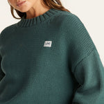 Model wears a Green Knit Sweater 