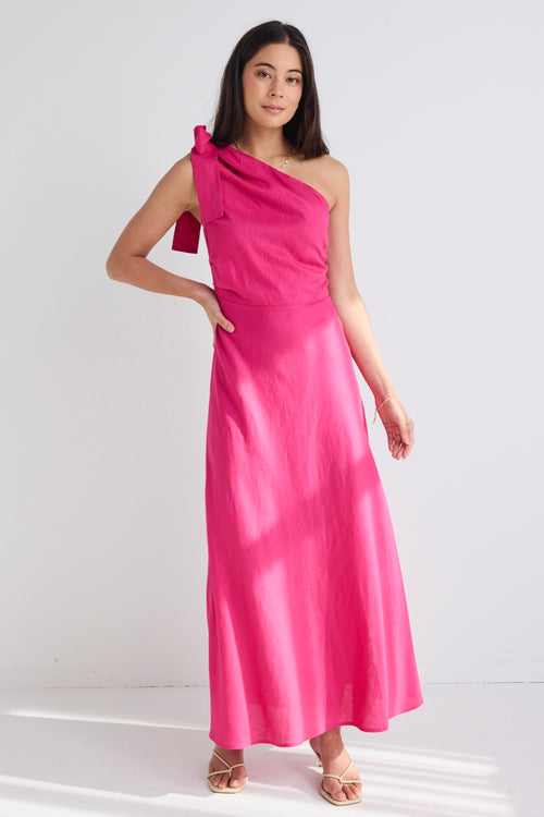 model wears a one shoulder pink midi dress