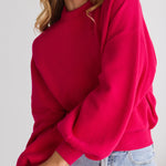 model wears a pink knit