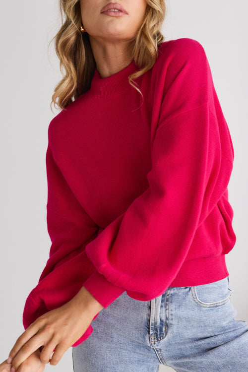 model wears a pink knit