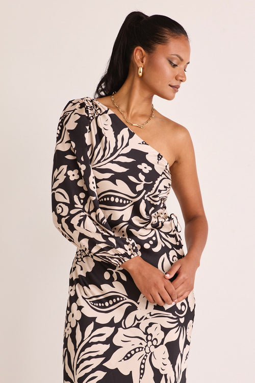 model wears a one shoulder black floral midi dress