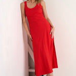 model wears a red linen maxi dress