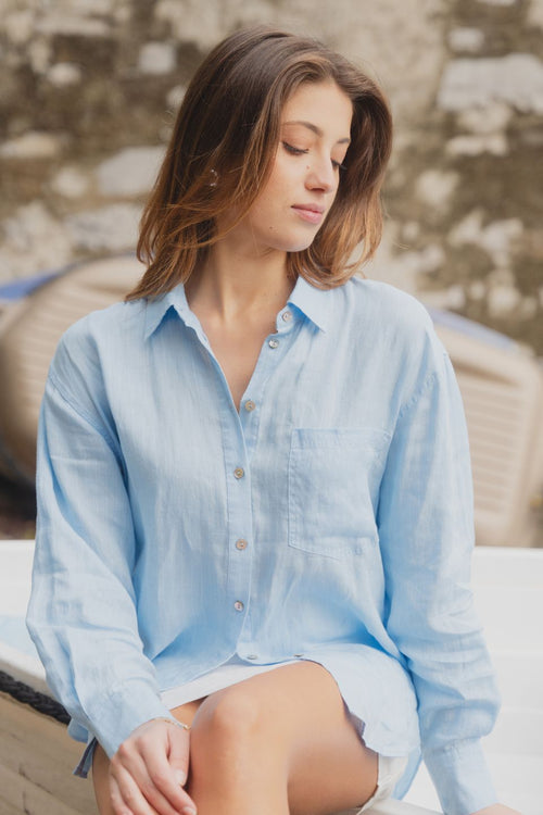 model wears blue oversized shirt