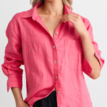 model wears a pink linen shirt 