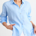 model wears blue oversized shirt