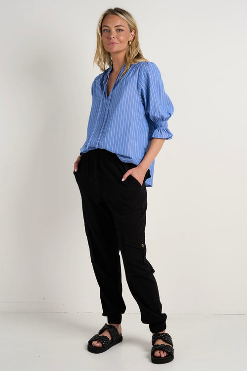 Model wears a blue stripe blouse