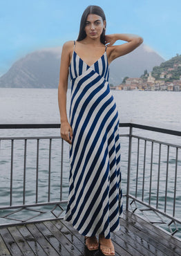 model wears navy and white stripe slip midi dress