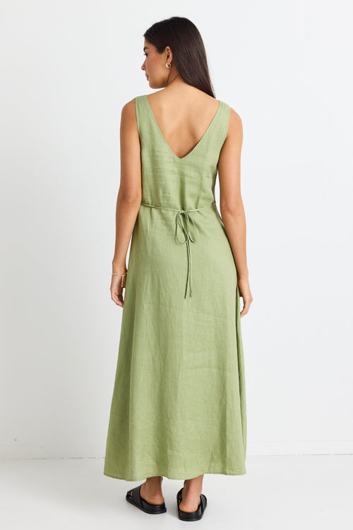 model wears a green linen midi dress