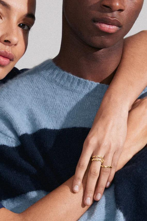 model wearing gold stackable rings