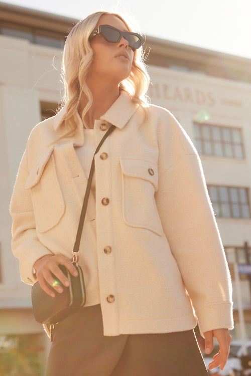 model wears a beige shacket