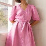 model wears pink linen mini dress