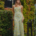 model wears floral green dress